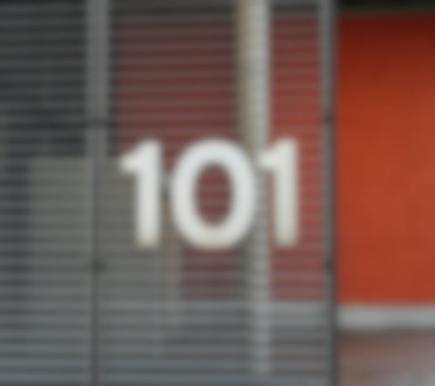 A slat window with the number 101 on it