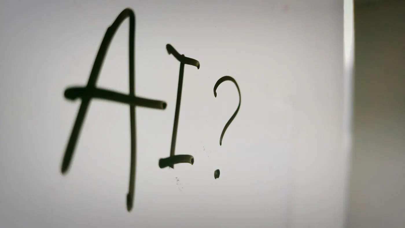 A white board with AI? written on it