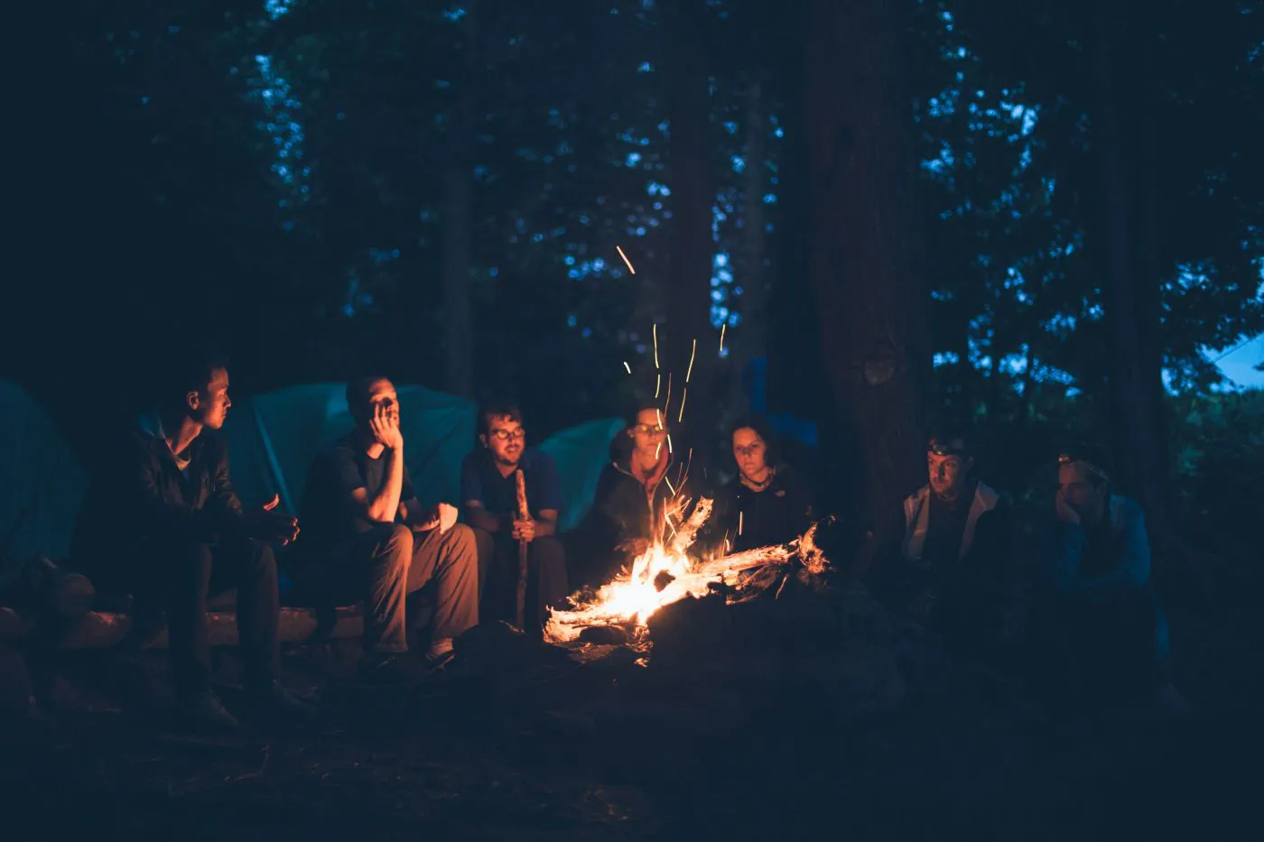 People sitting around a camp fire
