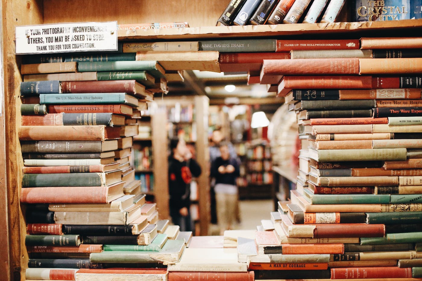 a round port hole made from staked books.