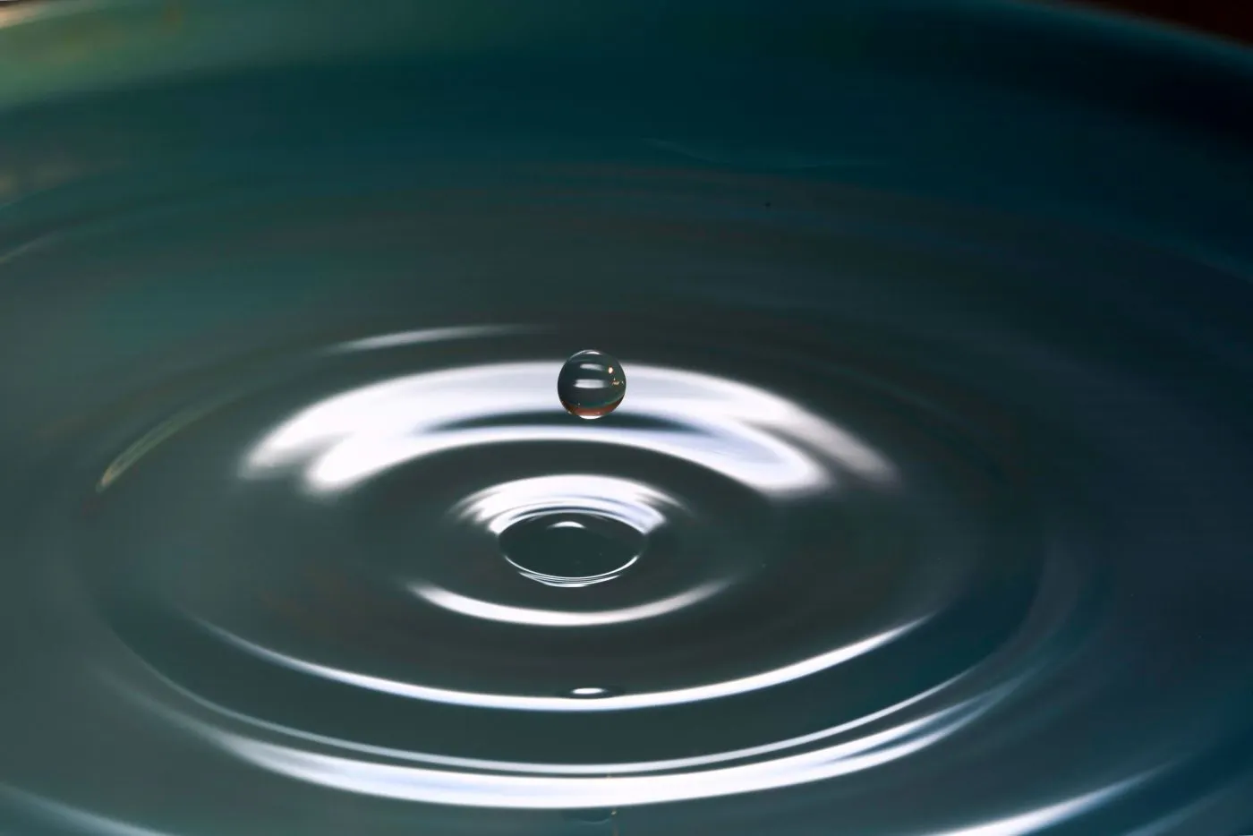 The circles around a drop of water with a drop suspended