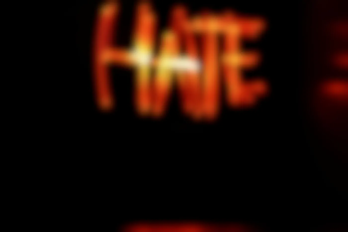 Red neon sign reading HATE