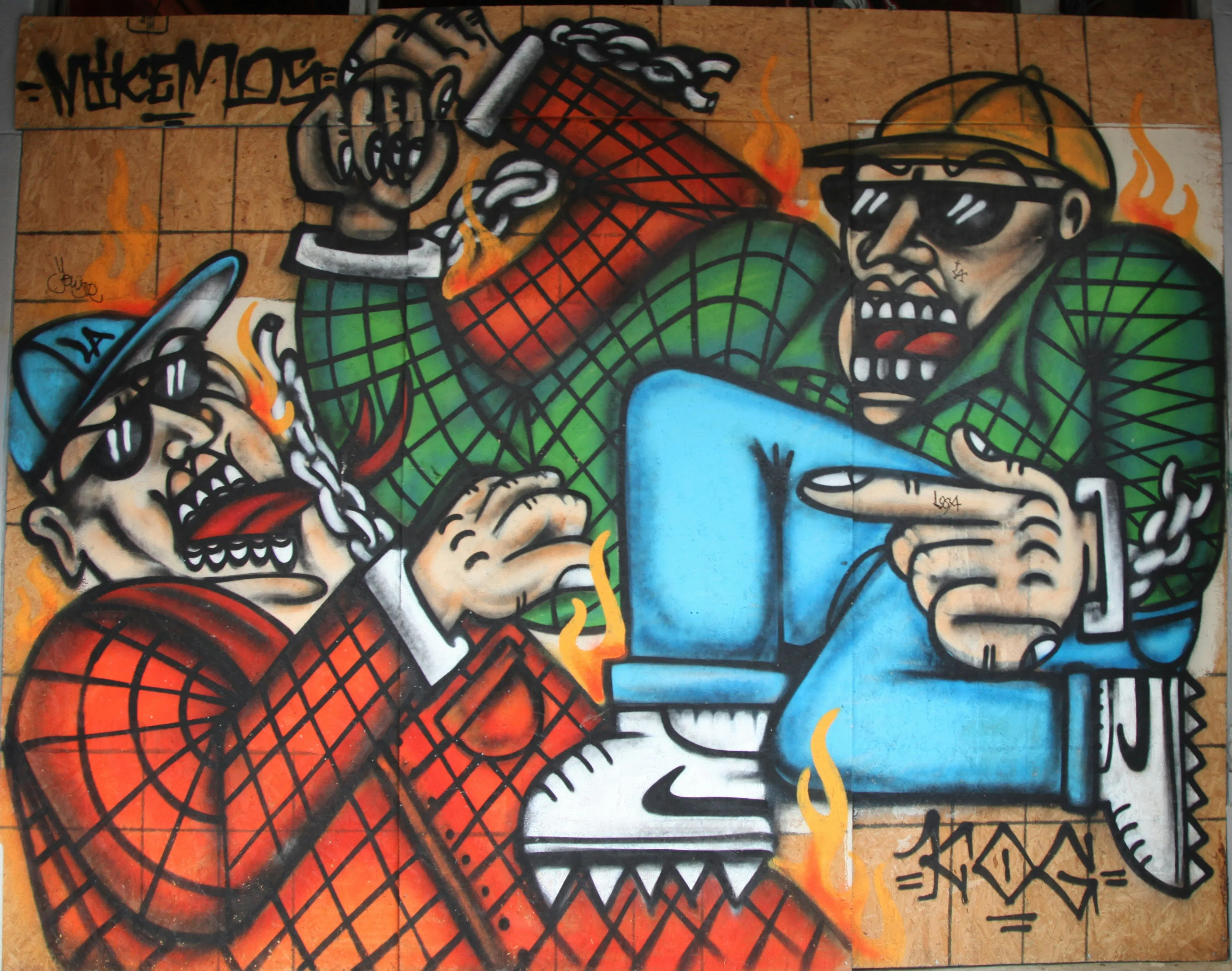Wall graffiti of two rappers