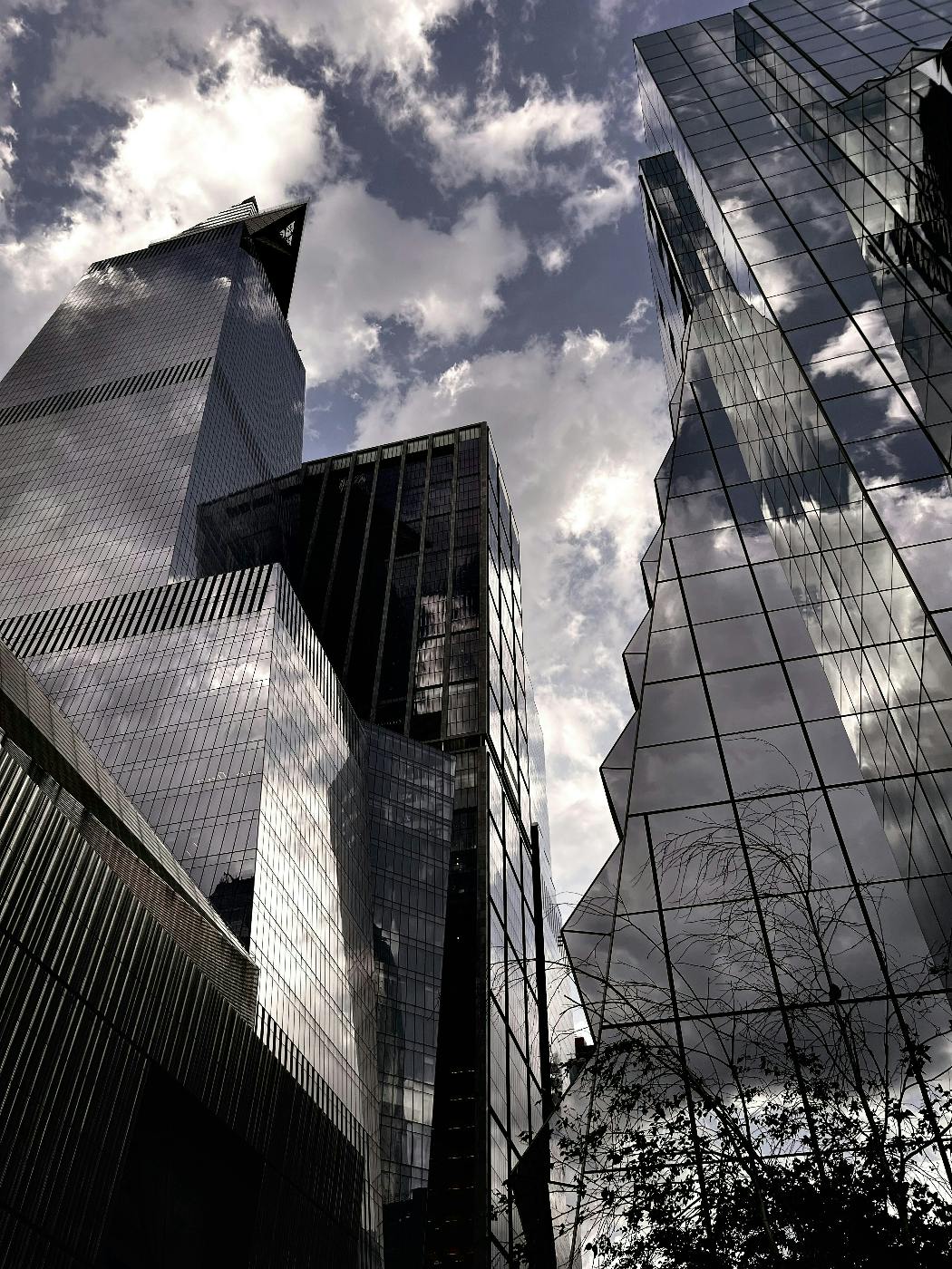 A view from below tall buildings with many sharp edges