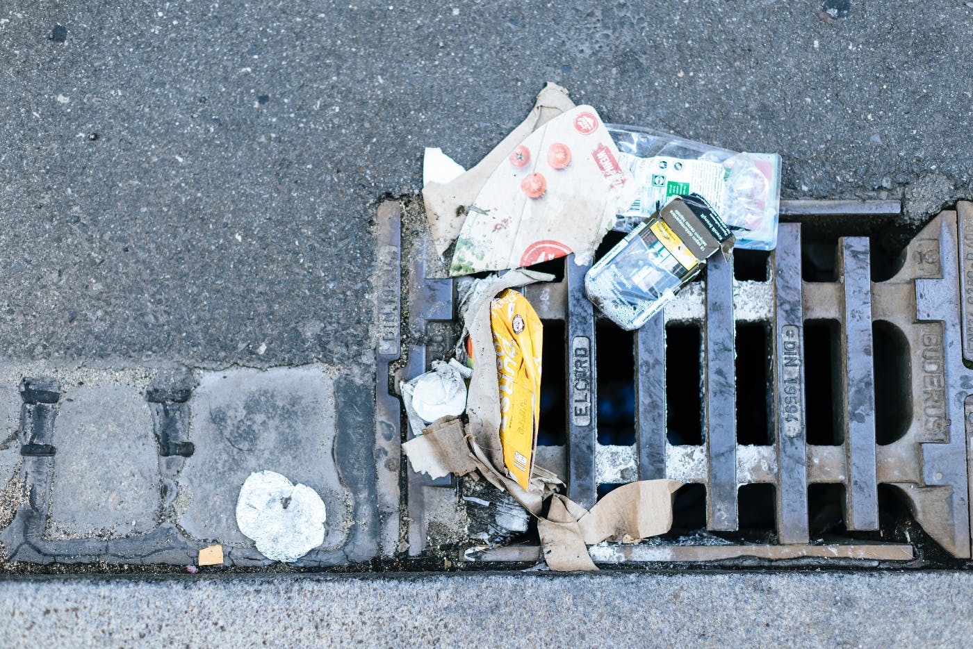 Gutter trash stopped by a storm drain