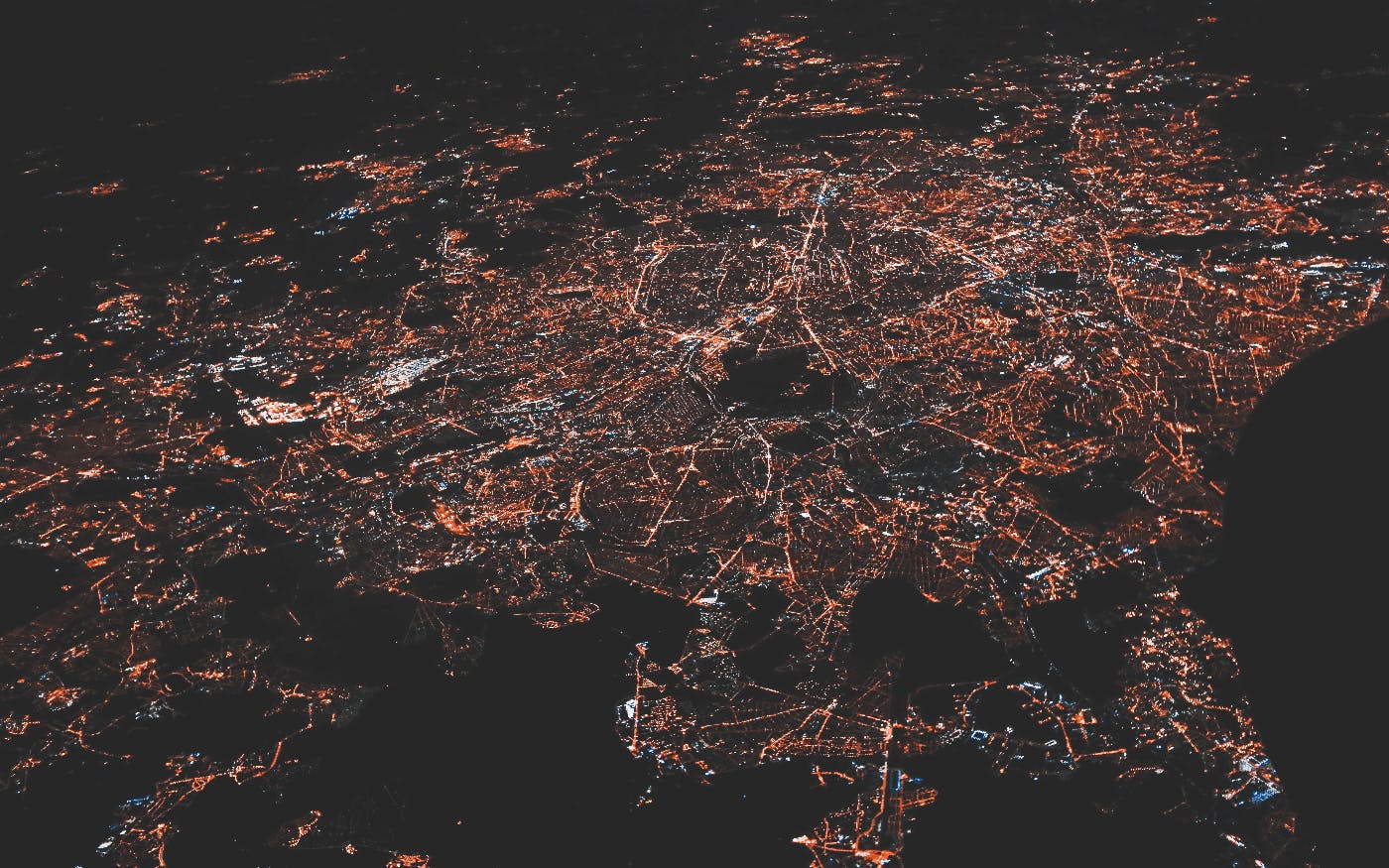 Aerial photo onf a city at night lit up