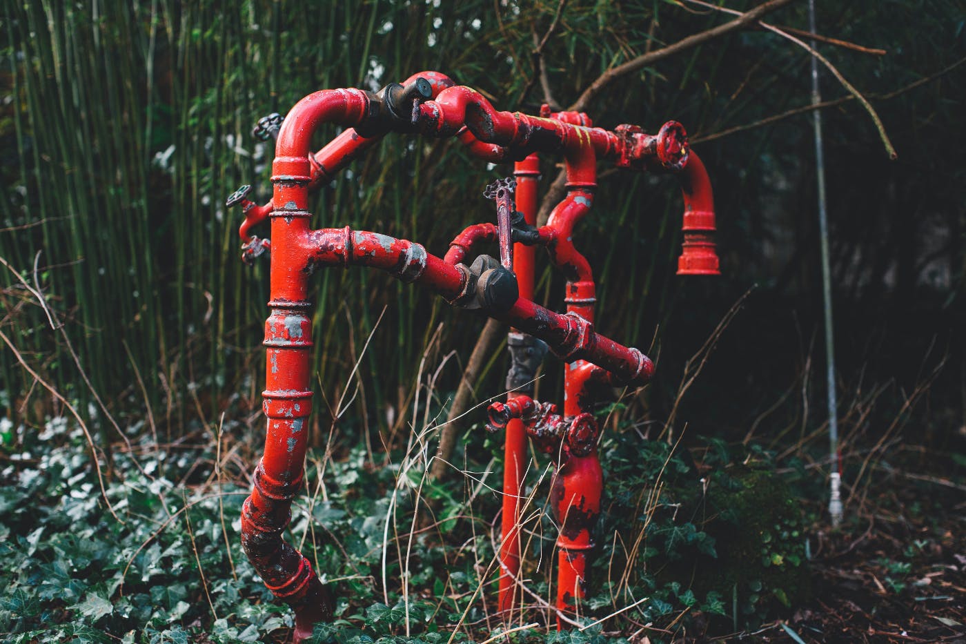 A tangle of old red pipes