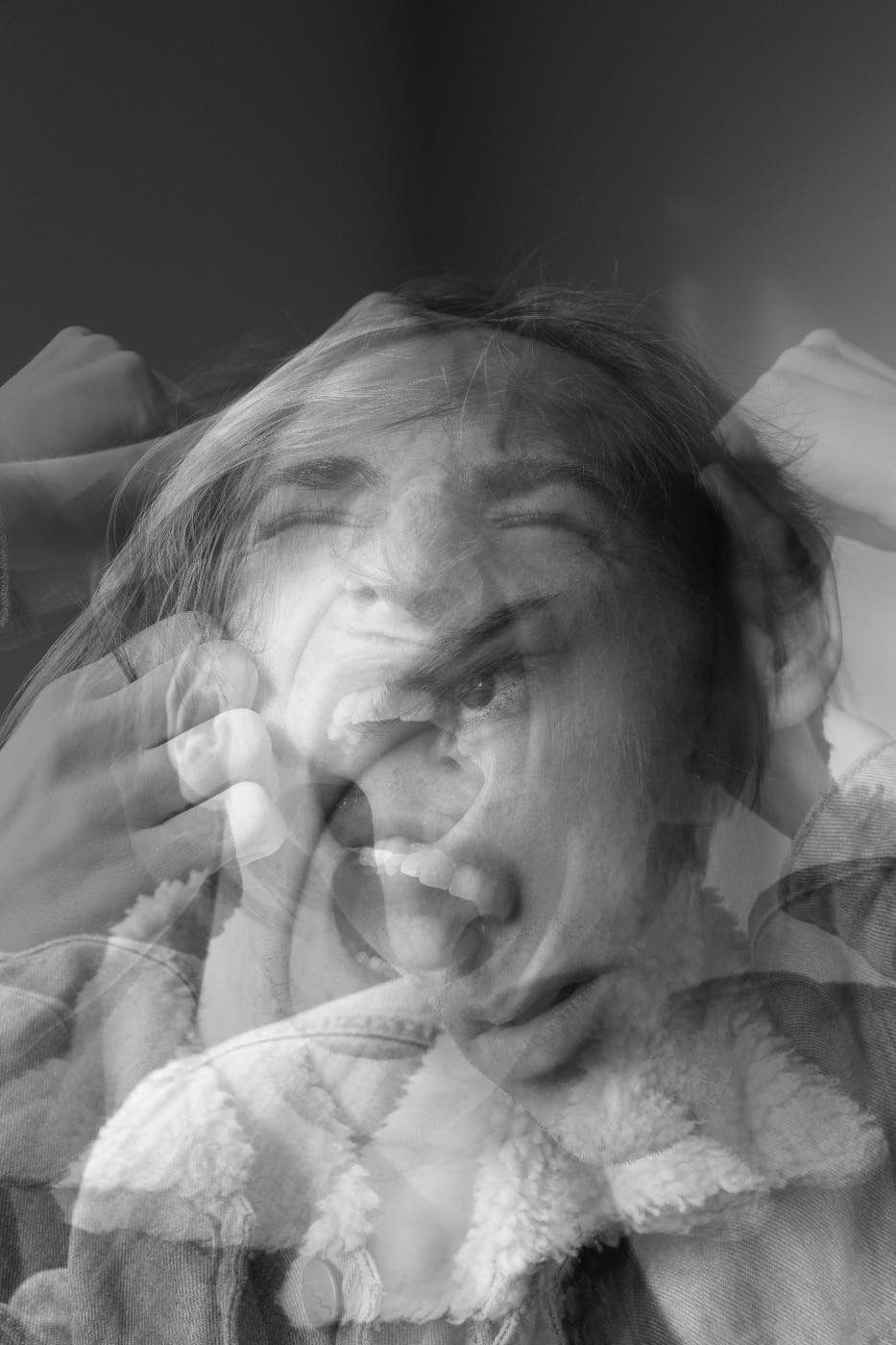 Overlapping images of a woman going through several emotions