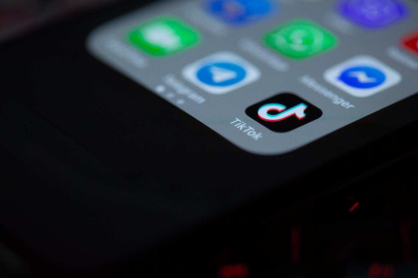 The bottom corner of a smartphone screen with a TikTok icon