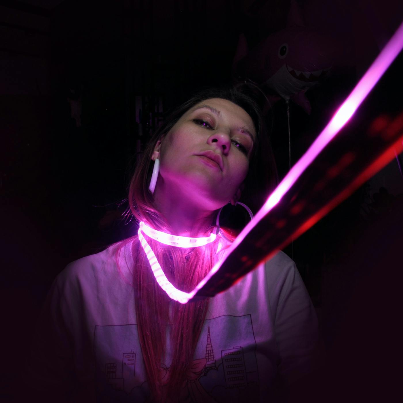 A woman with a band of lights around her neck