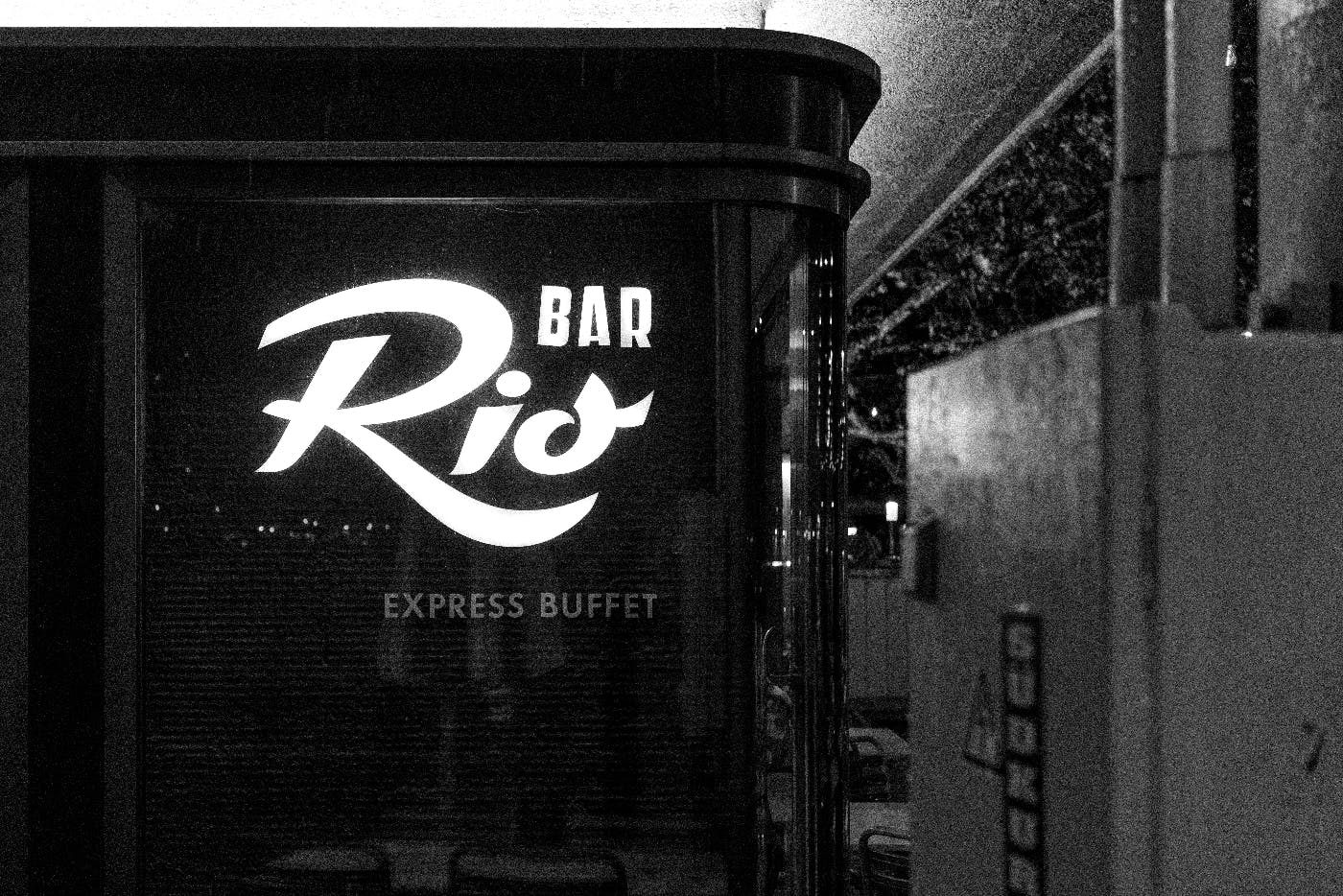 A restaurant sign reading Rio Bar Express Buffet