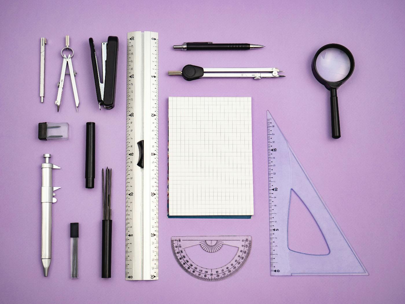 Design tools neatly displayed on a purple backdrop