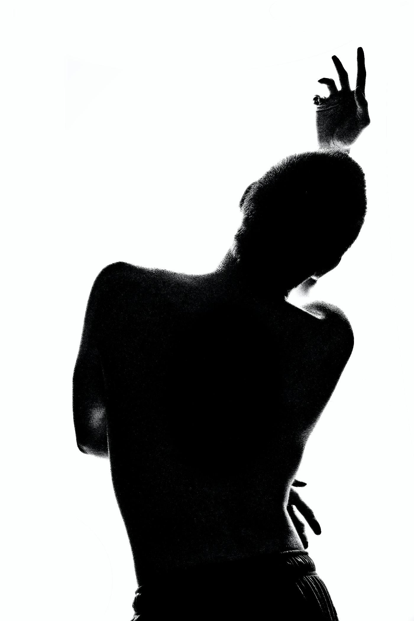A silhouette of a person dancing