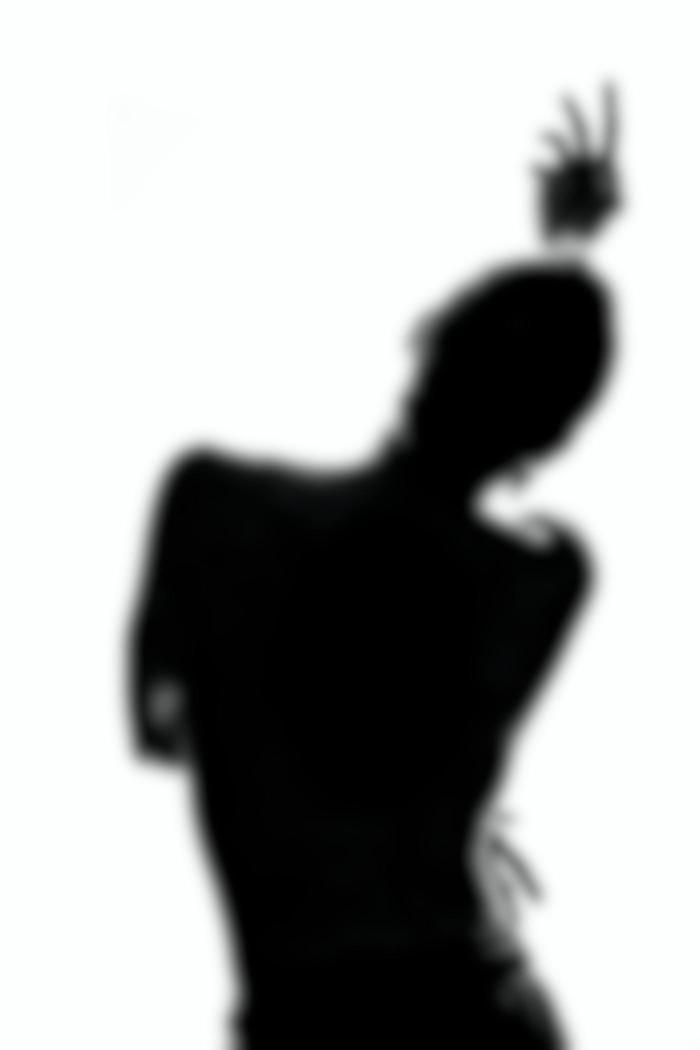 A silhouette of a person dancing