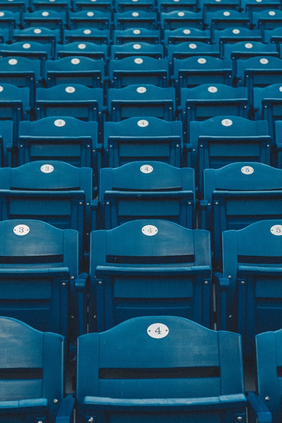 blue numbered seats in a baseball aprk