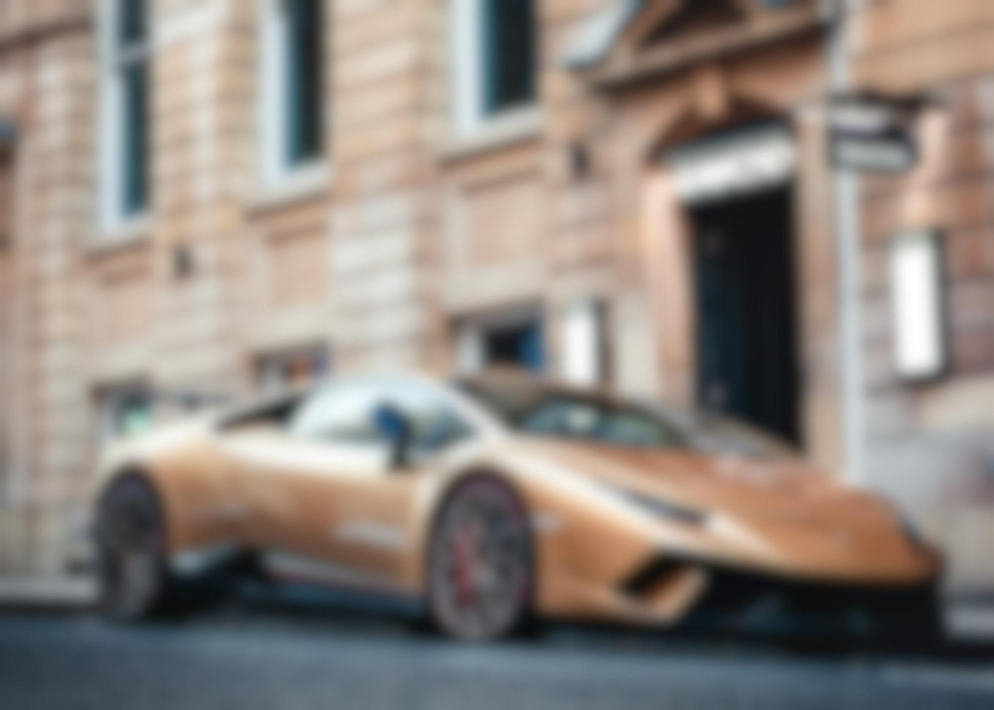 Luxury car parked in front of a luxury goods store