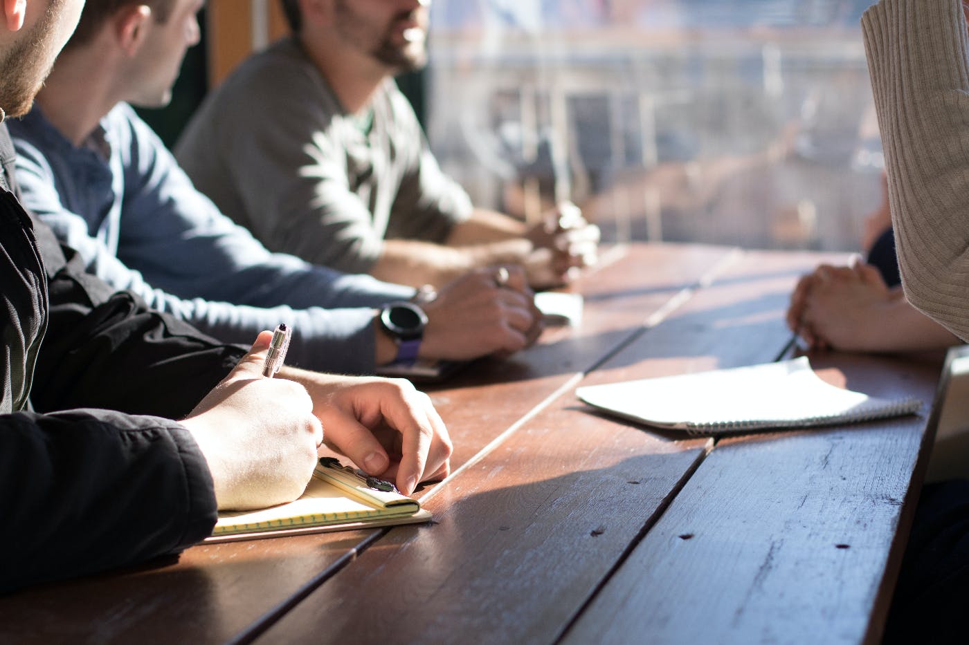 People at a table in a training session