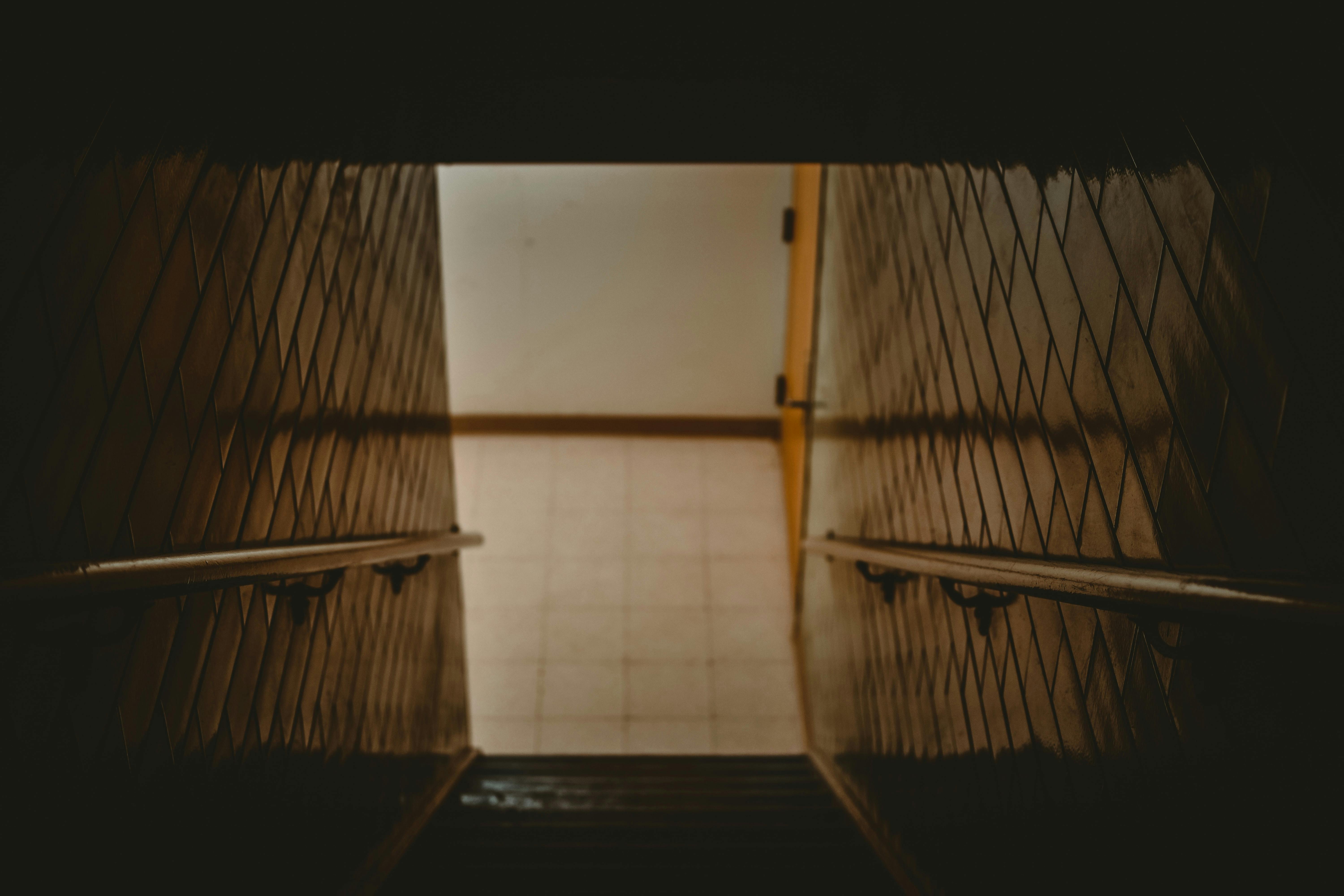 stairwell with tiled walls