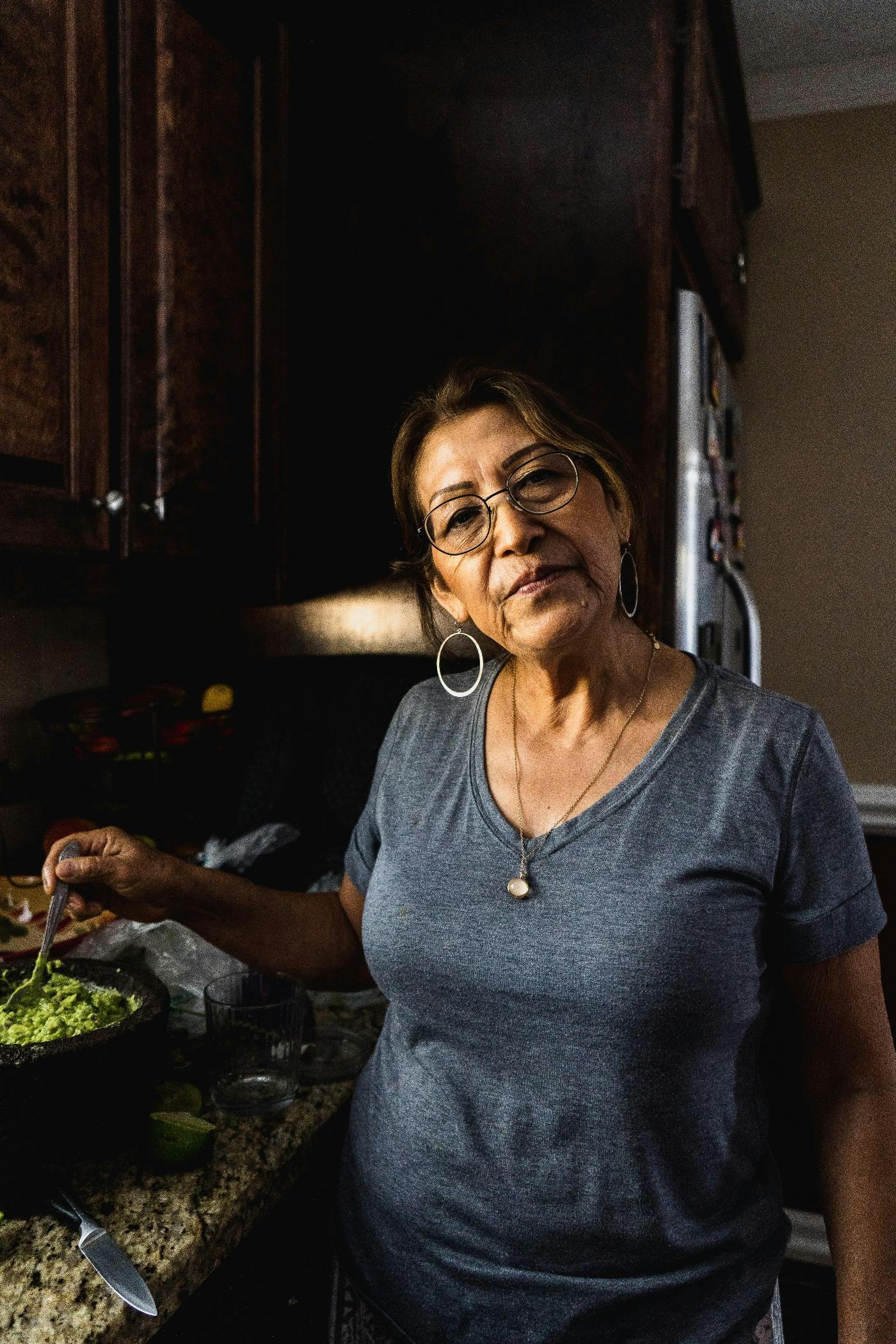 An older Hispanic woman cooking