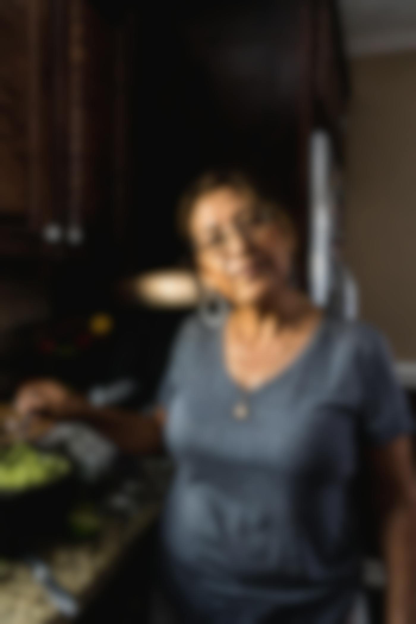 An older Hispanic woman cooking