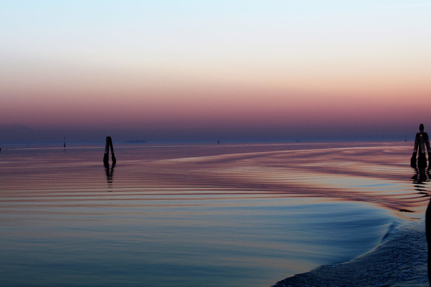 gentle ocean swells around posts