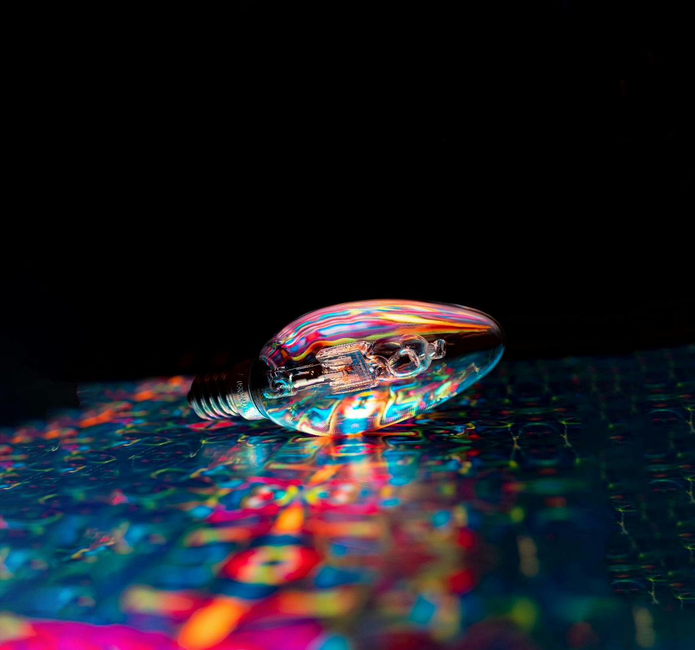 a lightbulb on a colorful mat