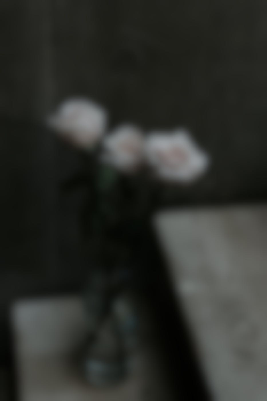 3 white roses in a vase
