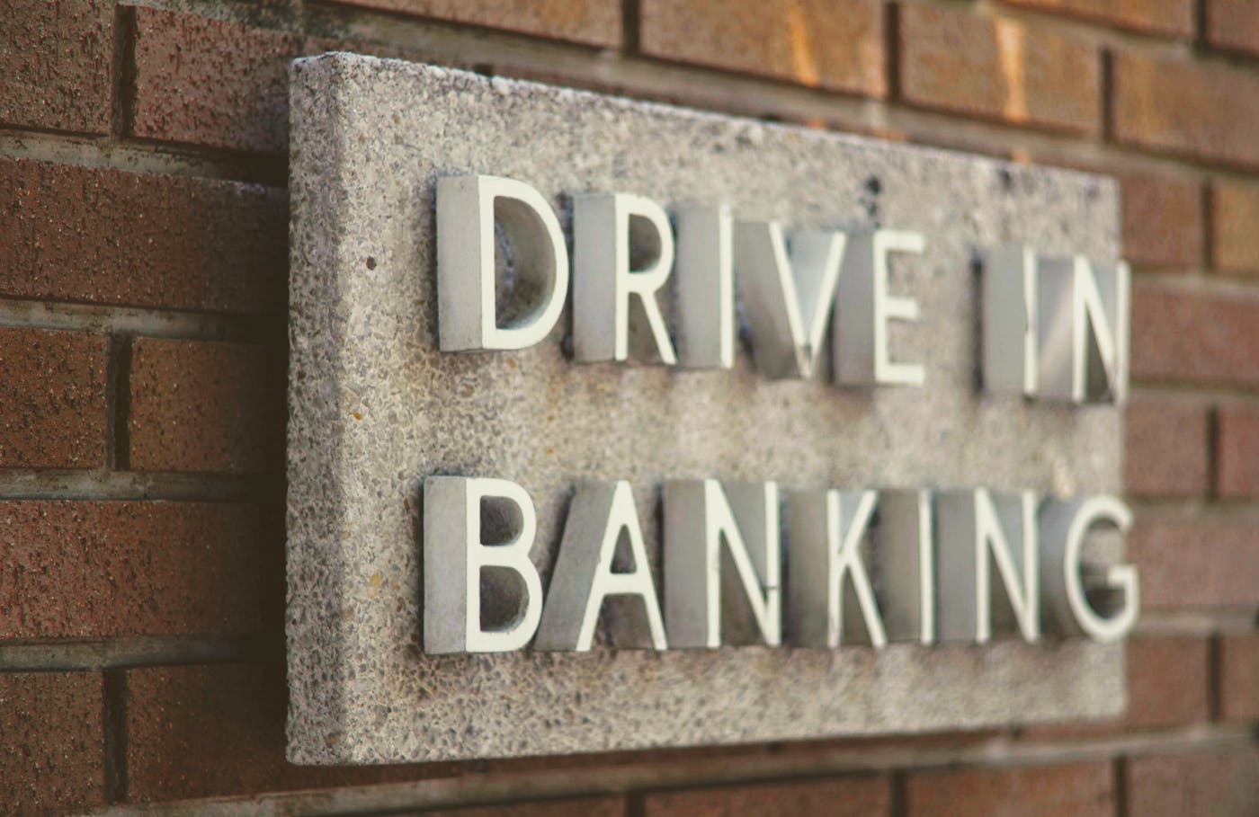 A sign reading Drive In Banking