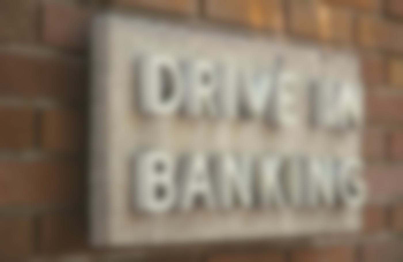 A sign reading Drive In Banking