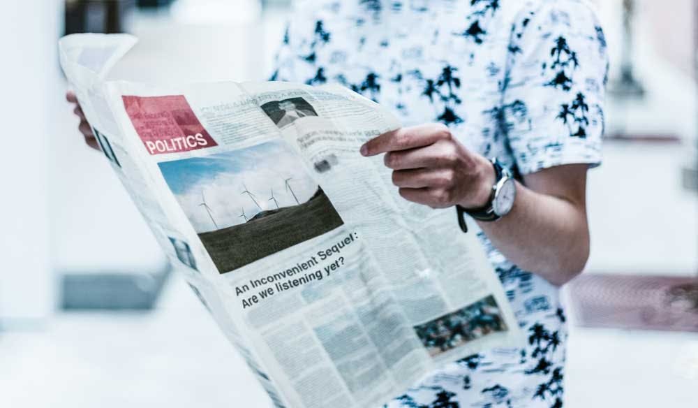 man reading a newspaper