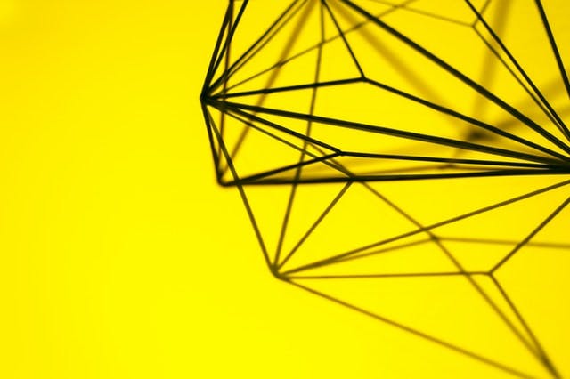 geometric diamond on yellow background