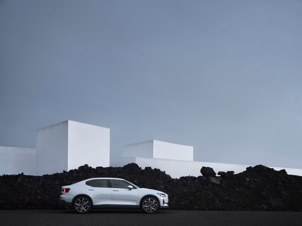 Side view of the Polestar 2 electric car against the Icelandic lava.
