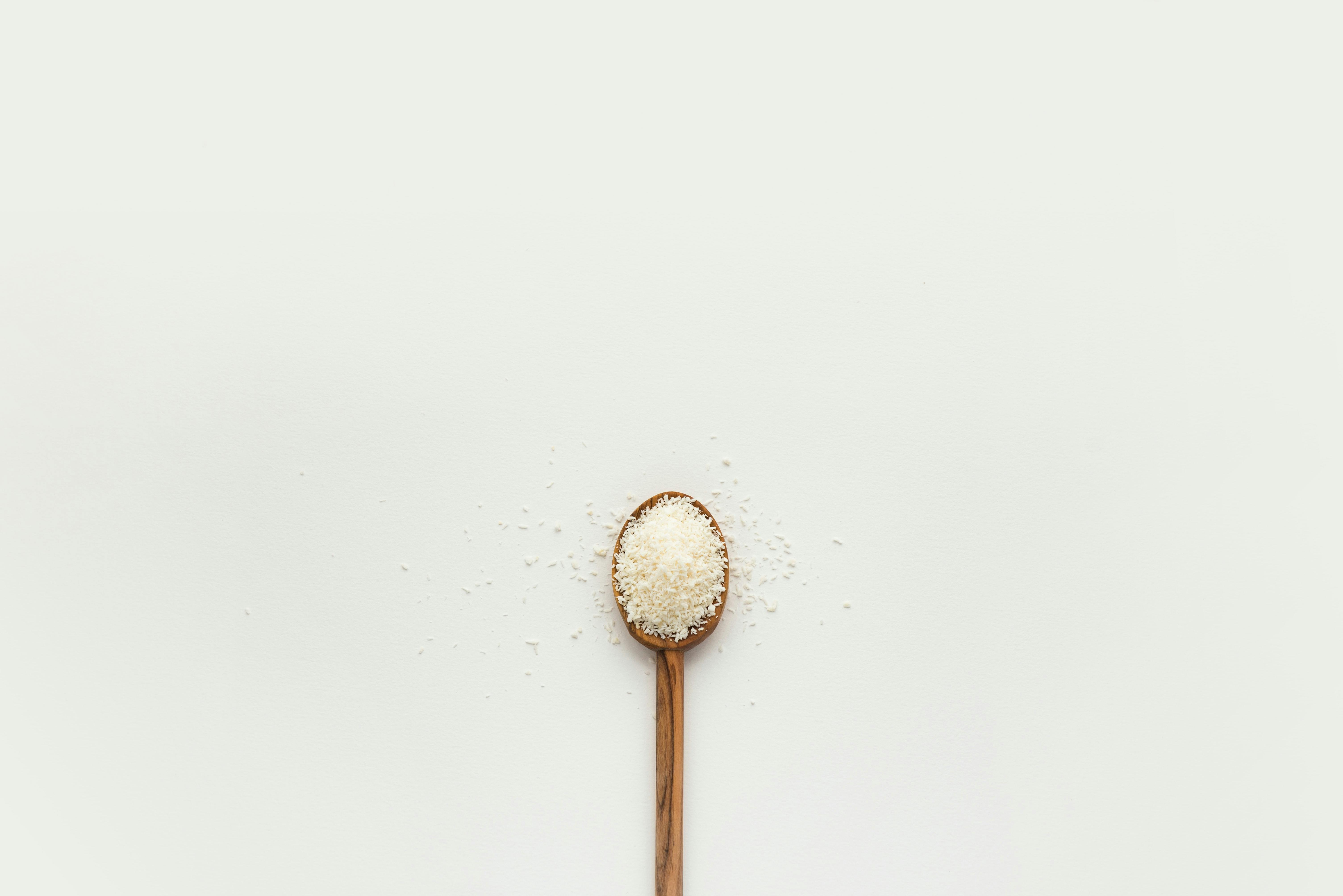 Grains of salt on wooden spoon