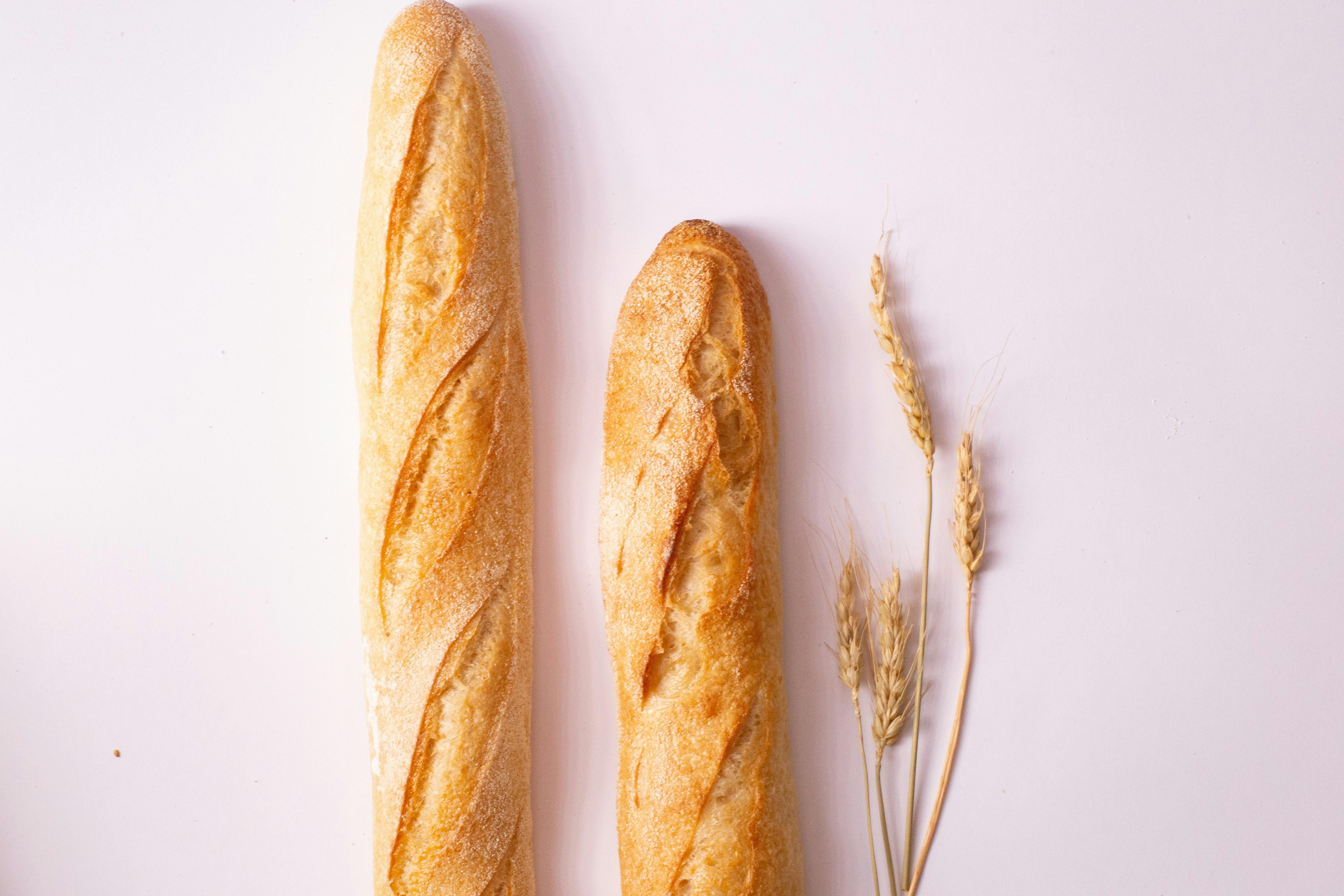French baguettes on pink background