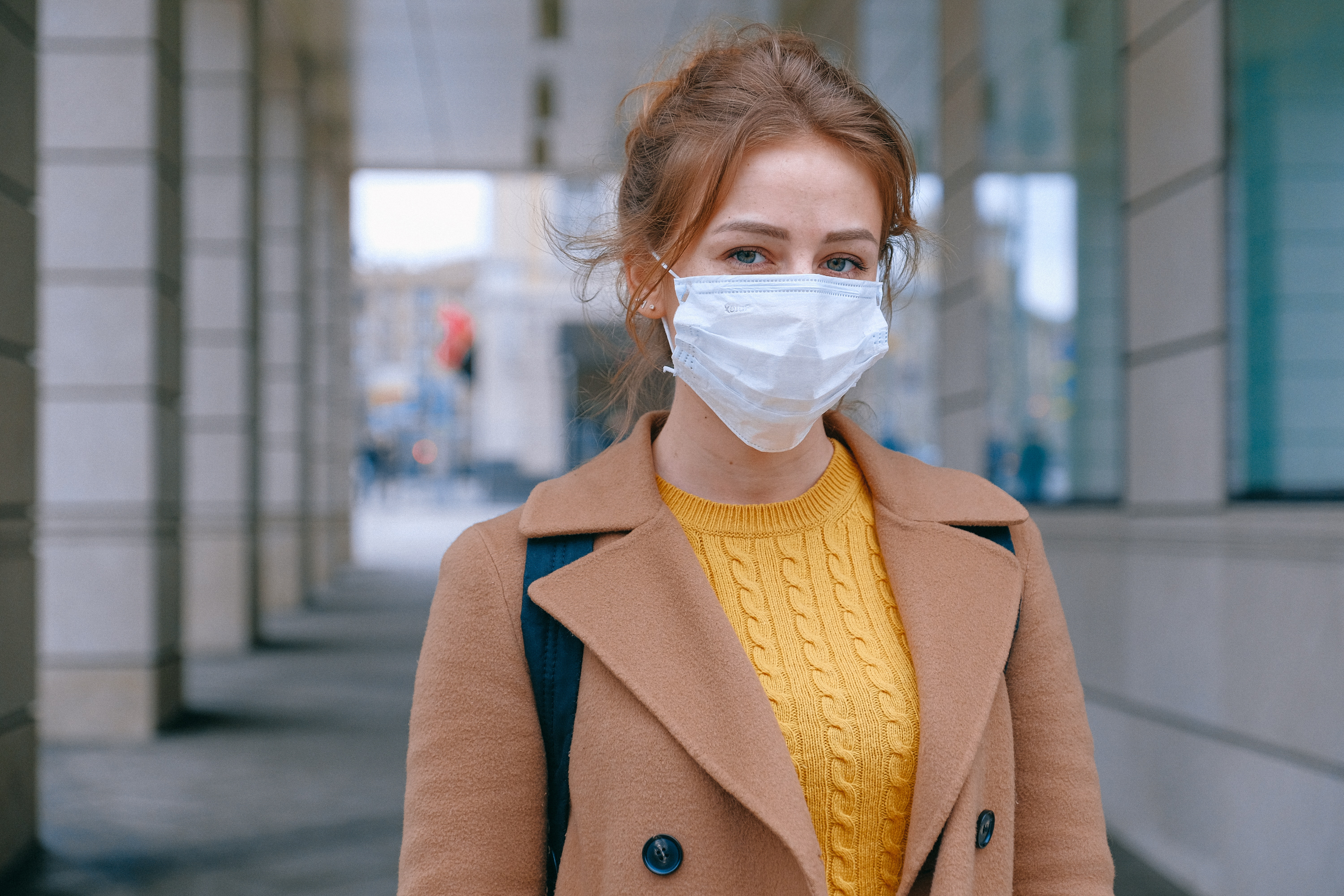 Woman wearing medial face mask to protect against COVID-19