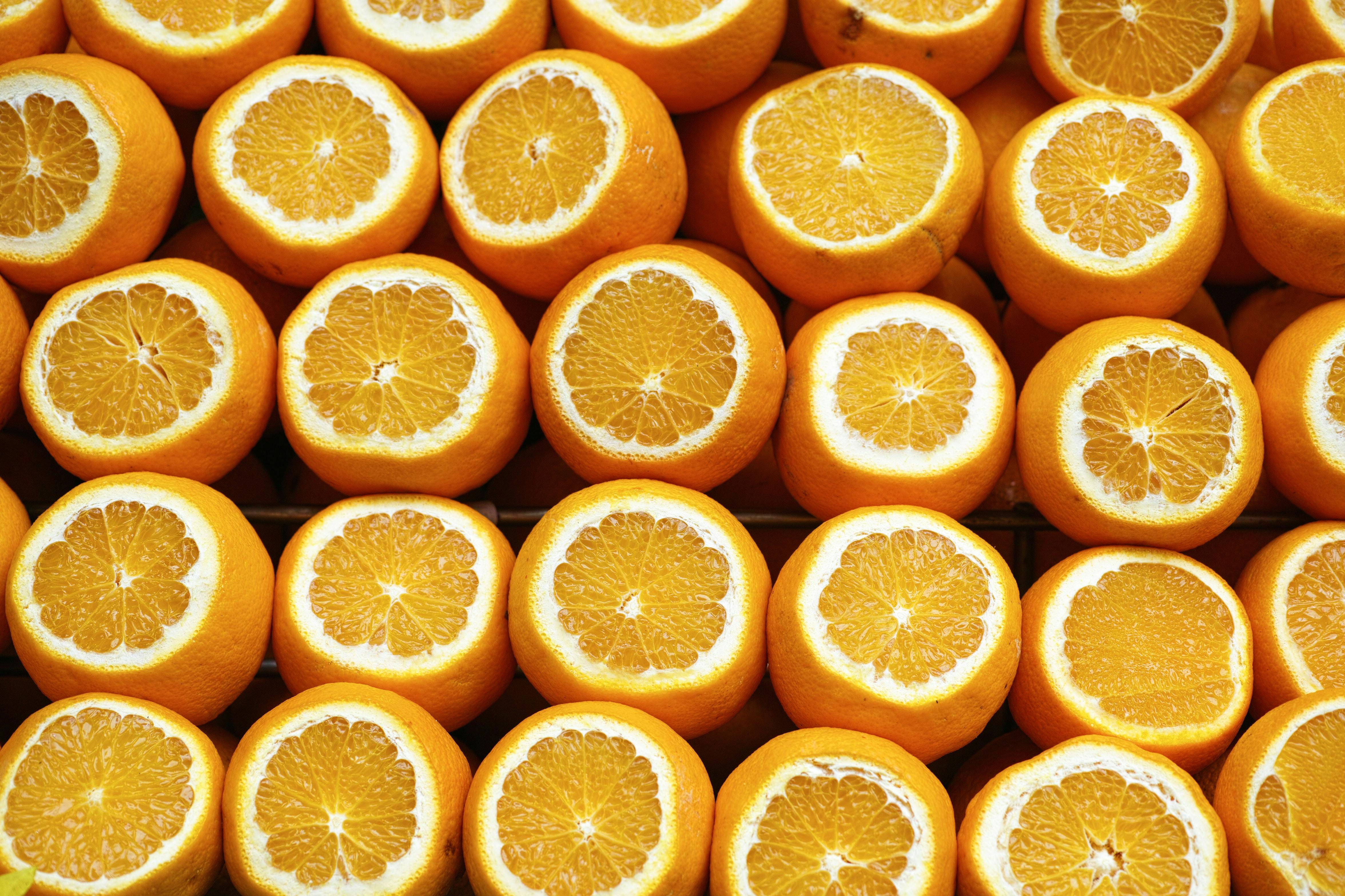 Oranges laid out and cut in half