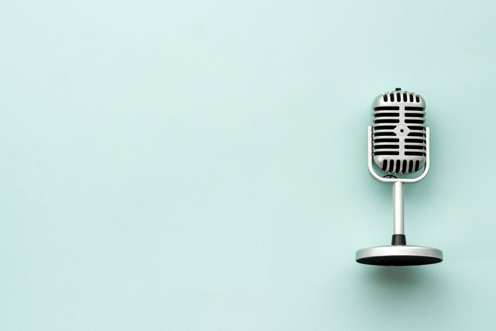 Podcast microphone blue background