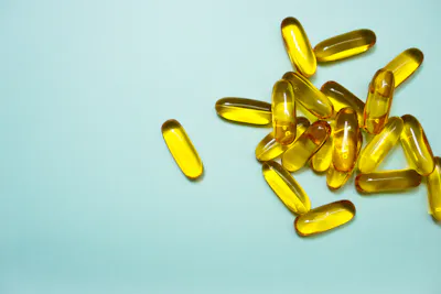Omega-3 supplements on blue background