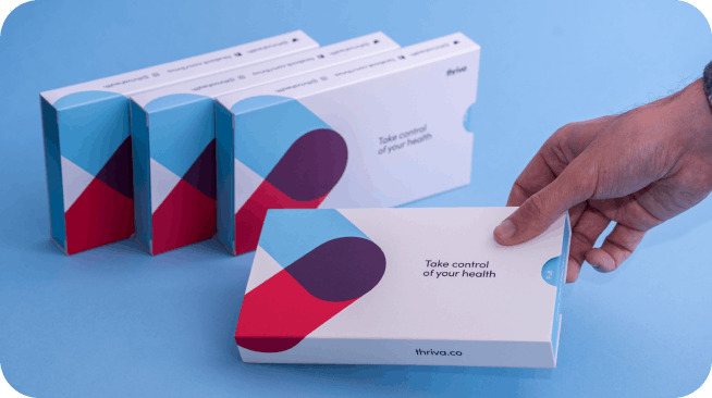 Thriva test kits on blue background