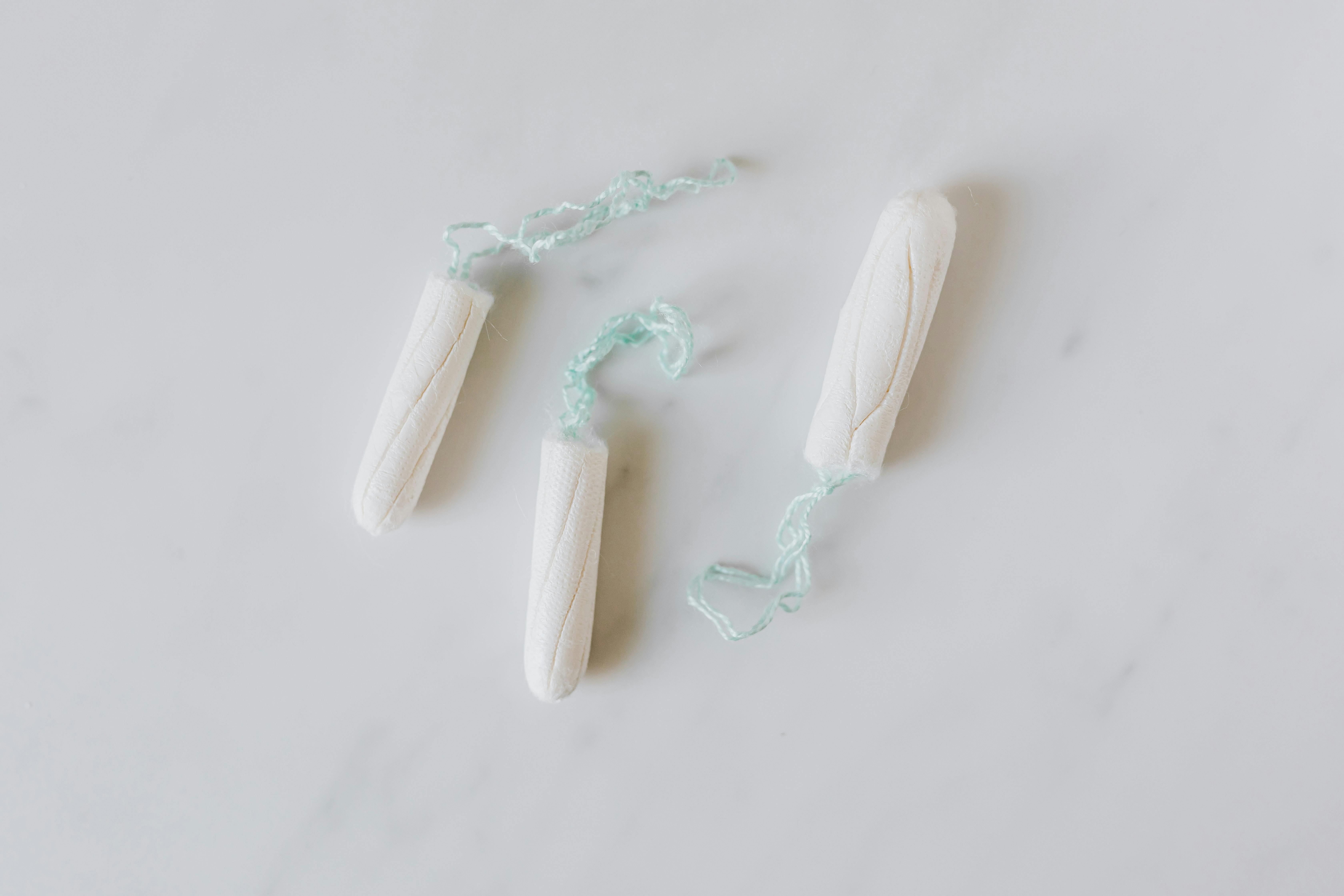 Three tampons on white background
