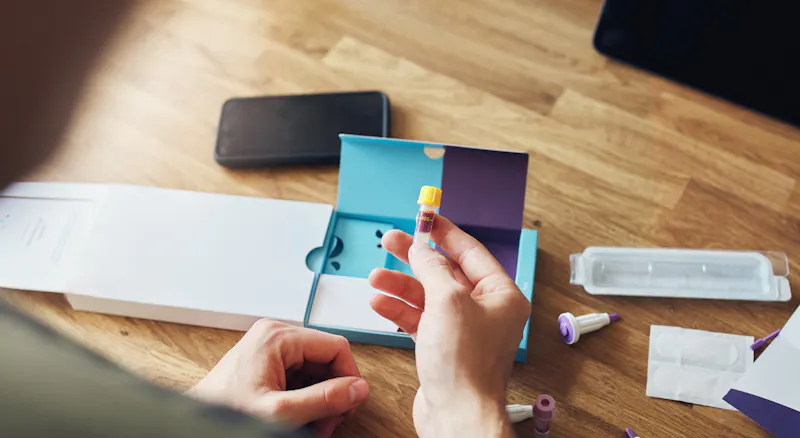 Image of a vial of blood and Thriva blood test.