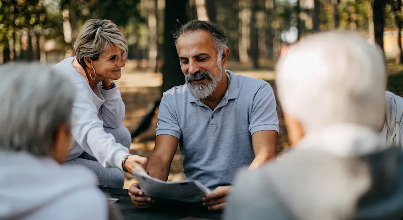 A man reading from a piece of paper.