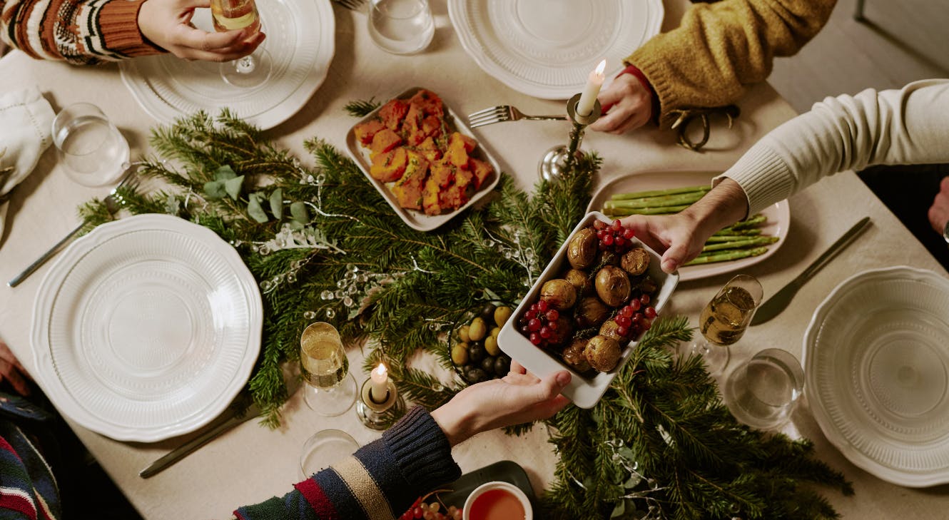 A group of people eating Christmas dinner