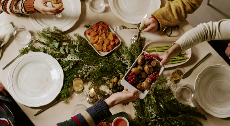 A group of people eating Christmas dinner