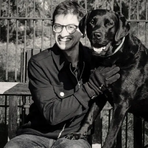 An image of Dr Lucas Denton with his dog