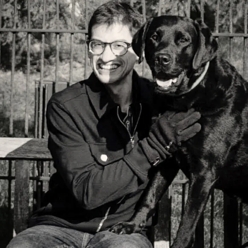 An image of Dr Lucas Denton with his dog