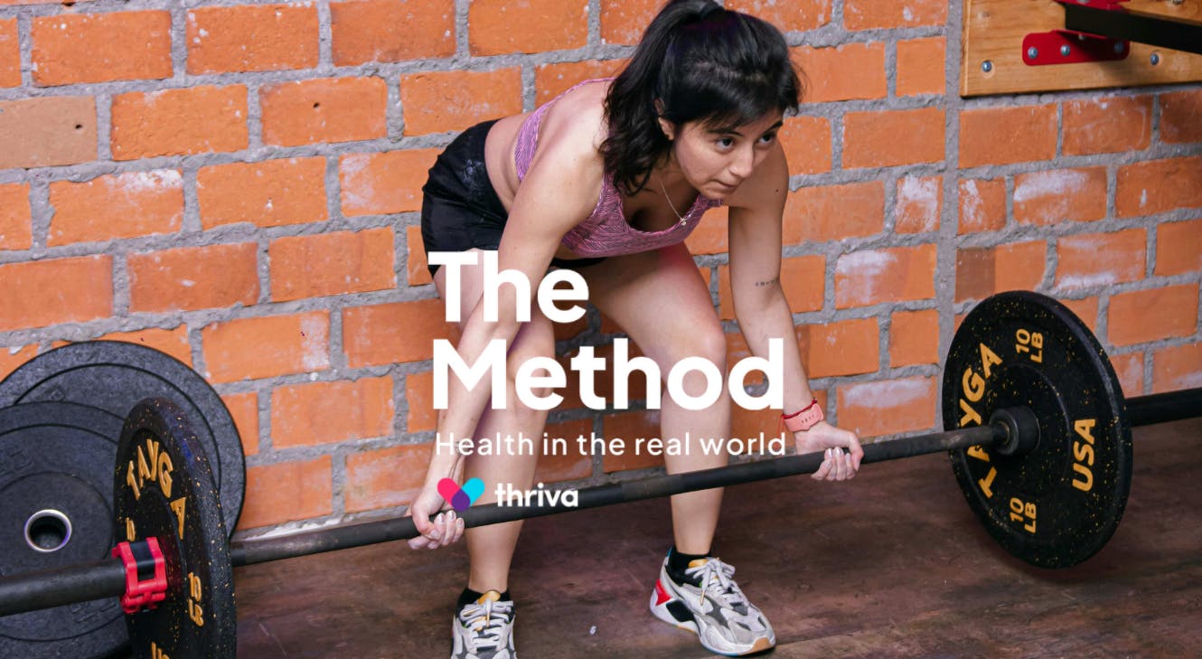 A woman lifting a weight.