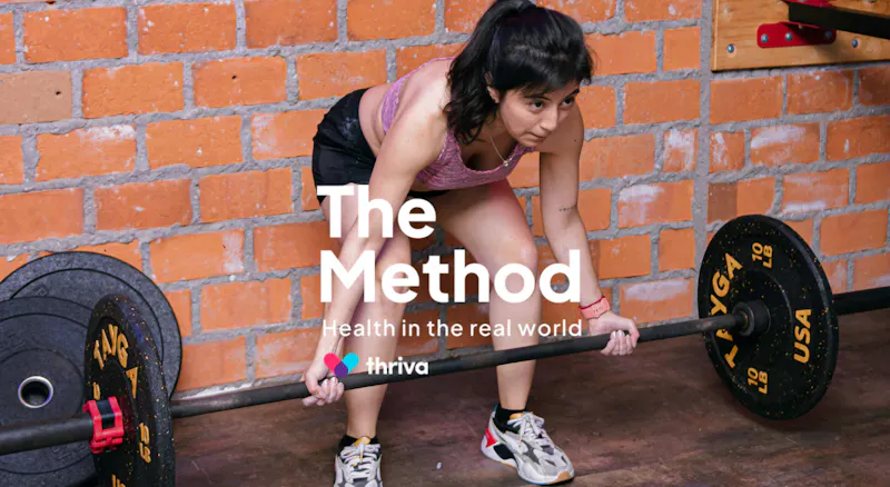 A woman lifting a weight.