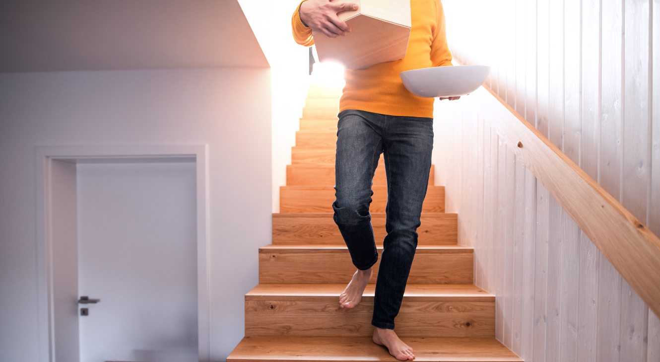 A man walking down the stairs.