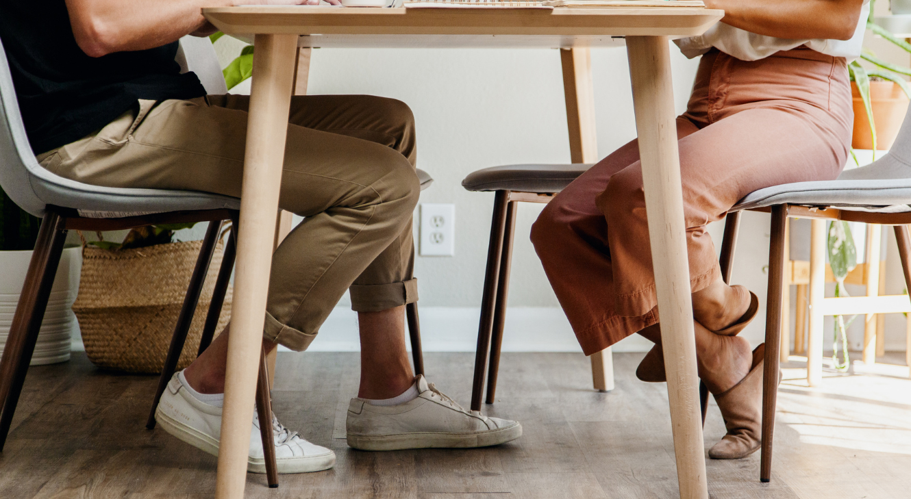 A man and a woman sitting at a table.